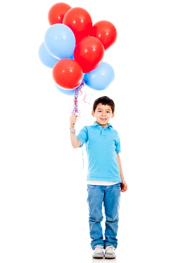 Boy holding colorful balloons - isolated over a white background