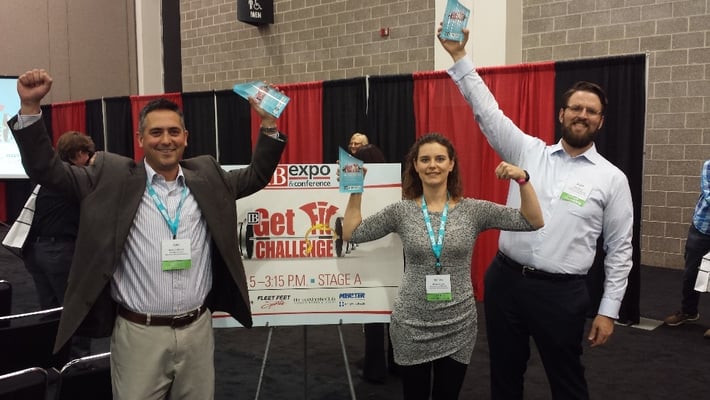 Hausmann Johnson Employees at a conference exhibit