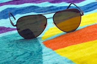 Aviator sunglasses on beach towel-1