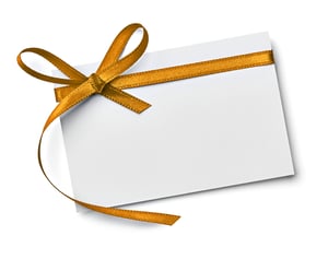 close up of a  note card with ribbon bow on white background