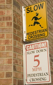 Two signs are better than one warning signs for motorists to slow down at pedestrian crossing
